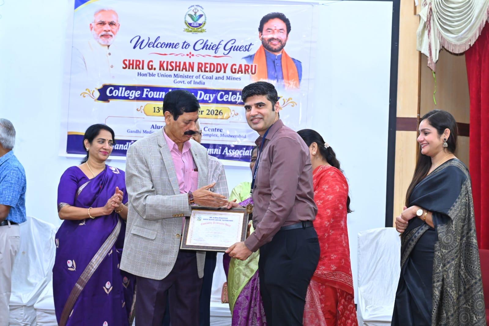 Dr. Manpreet receiving an academic certificate at a recognition event
